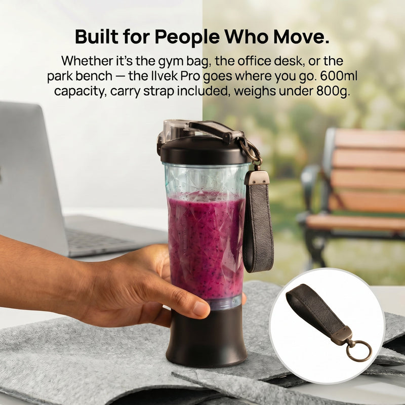 Ilvek Pro Portable Blender with a 600ml capacity and carry strap, shown on an office desk with a laptop and a park bench in the background.