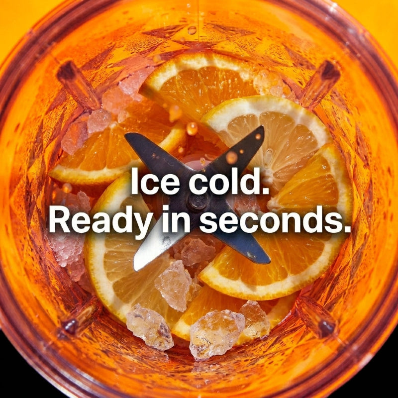 Top-down view inside an Ilvek Blender Pro showing fresh orange slices and crushed ice surrounding a stainless steel blade with high-end editorial lighting.